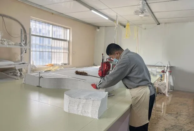 Fabric cutting in the Lemaji baby textile factory