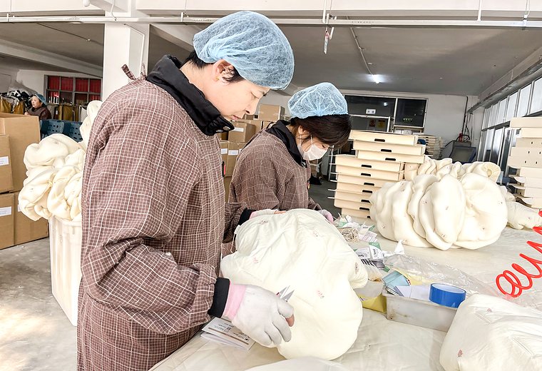 Factory quality check of filled baby textile products