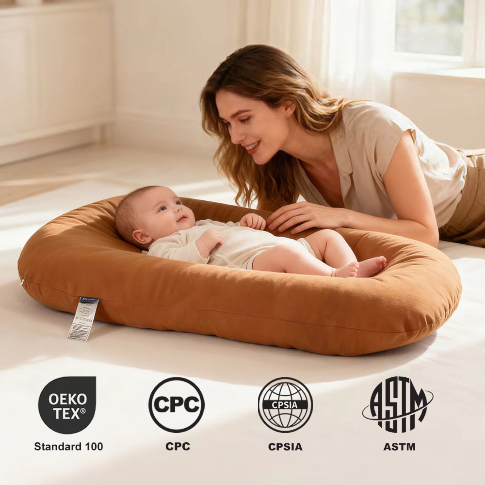 Baby lounger bedside sleeper lifestyle image with safety documentation icons