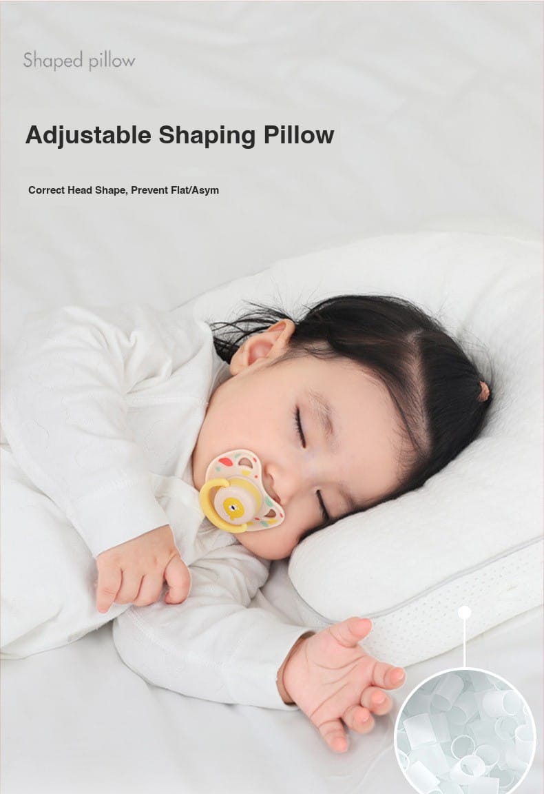 Baby sleeping on adjustable head-shaping pillow