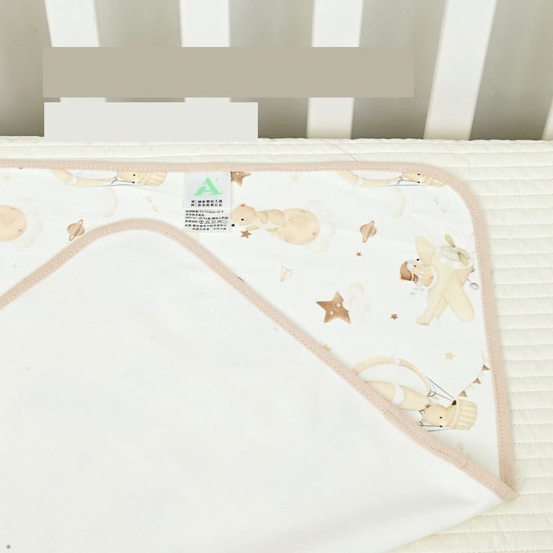 Waterproof pad corner with baby-safe label