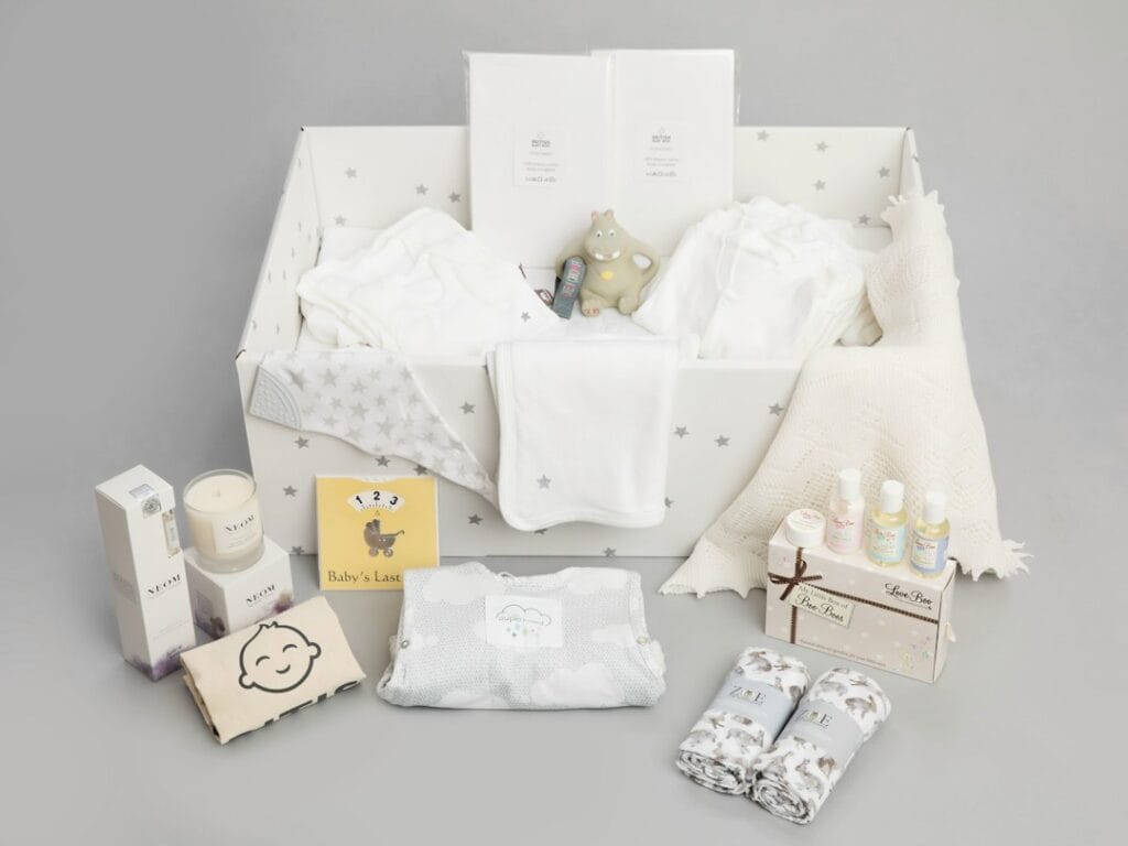 Custom newborn baby gift set with coordinated textile items and packaging